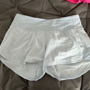 Sky blue mid rise speed up shorts 4 inch inseam size 6